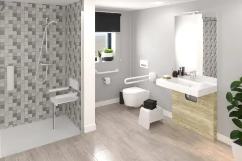 Agencement salle de bain moderne et accessible avec douche, WC suspendu, lavabo et barres d'appui.